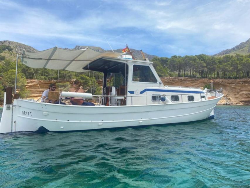 Alcudia: Private Sunset Boat Trip with Glass of Wine & Snack - Aucanada Lighthouse and the swimming stop