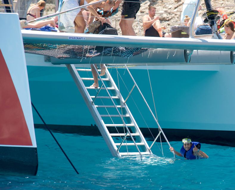 Alcudia: Sunset Catamaran Tour with Dinner and Snorkeling - Music, crew energy, and the feel on board