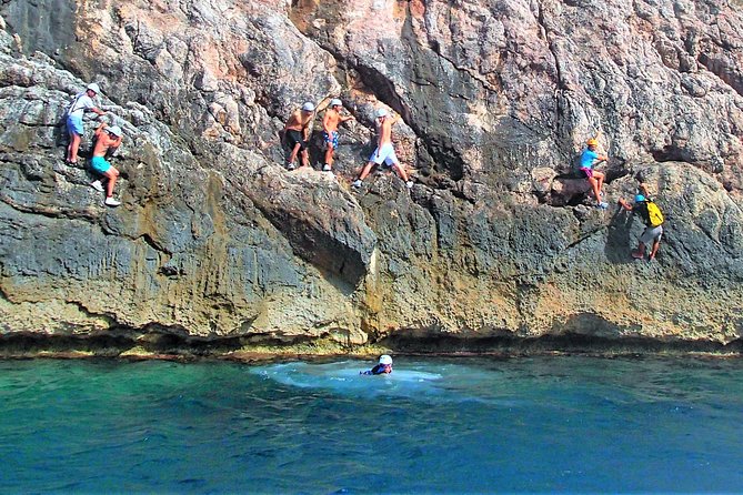 Coasteering Cliff jumping - Abseiling into the sea and entering the cave