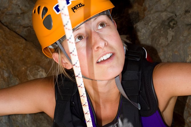 East Mallorca Coasteering Experience with Transfers - Abseiling down a cliff near the water