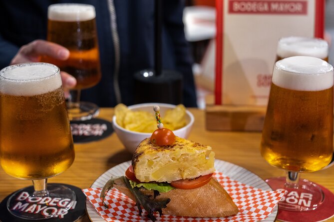 Gourmet Tapas and Wine Tour in Palma de Mallorca - Walking Carrer del Sindicat between food stops