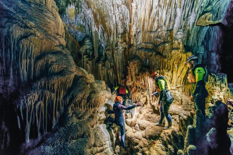 Mallorca: Cova des Coloms Caving Trip with Hotel Transfer - Inside the cave: climbing, scrambling, and natural lakes