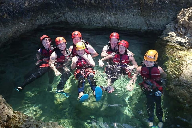 Mallorca Half-Day Coasteering Experience - Abseiling down a cliff toward the water