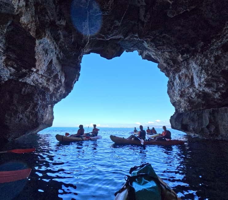 Mallorca: Sea Cave Kayaking Tour with Snorkeling and a Snack - Inside the sea caves and along the cliffs
