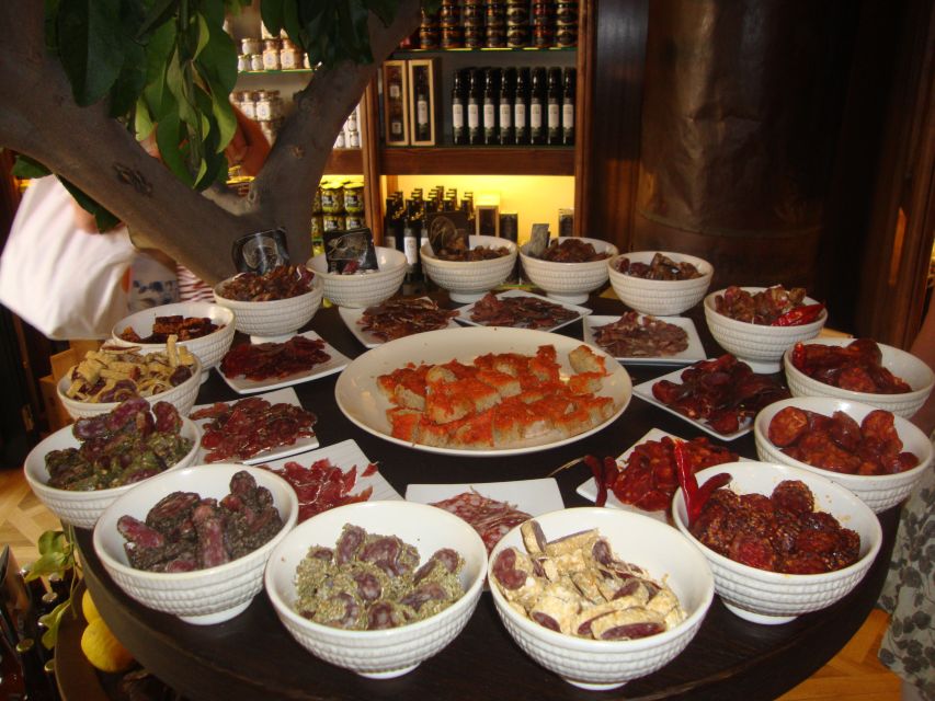 Palma Tour with Wine and Tapas Tasting - Olive oil, ham, cheese, and Spanish tapas